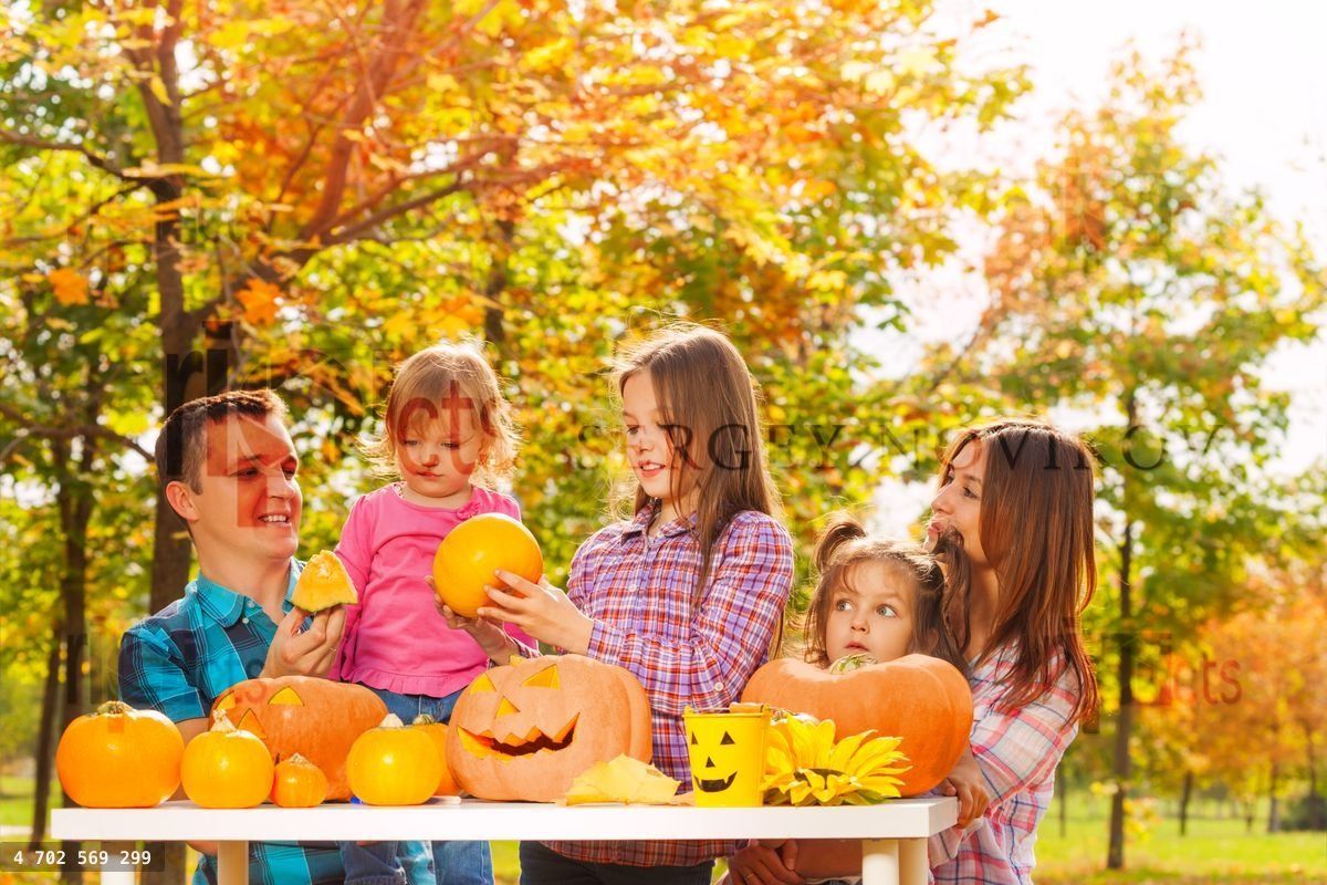 Family with three kids prepare for Halloween
