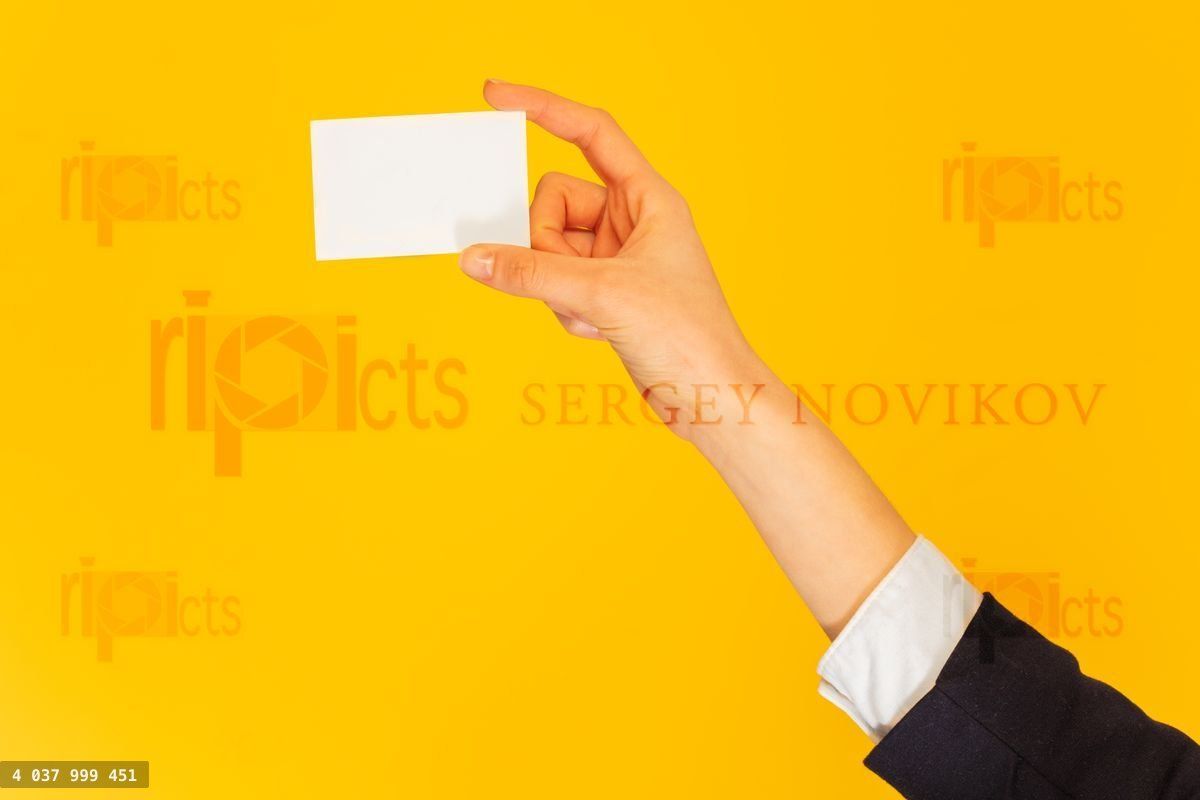 Woman's hand giving name card with copy space