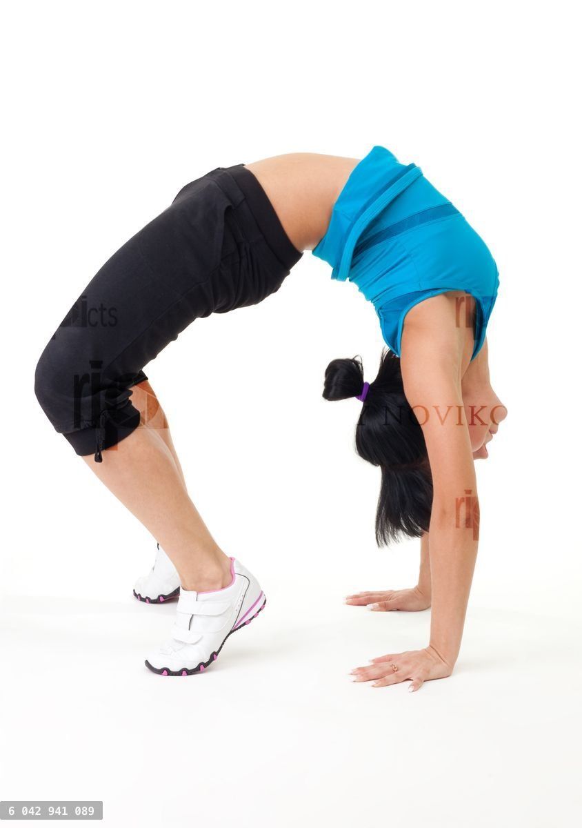 Woman holding bridge stretching pose