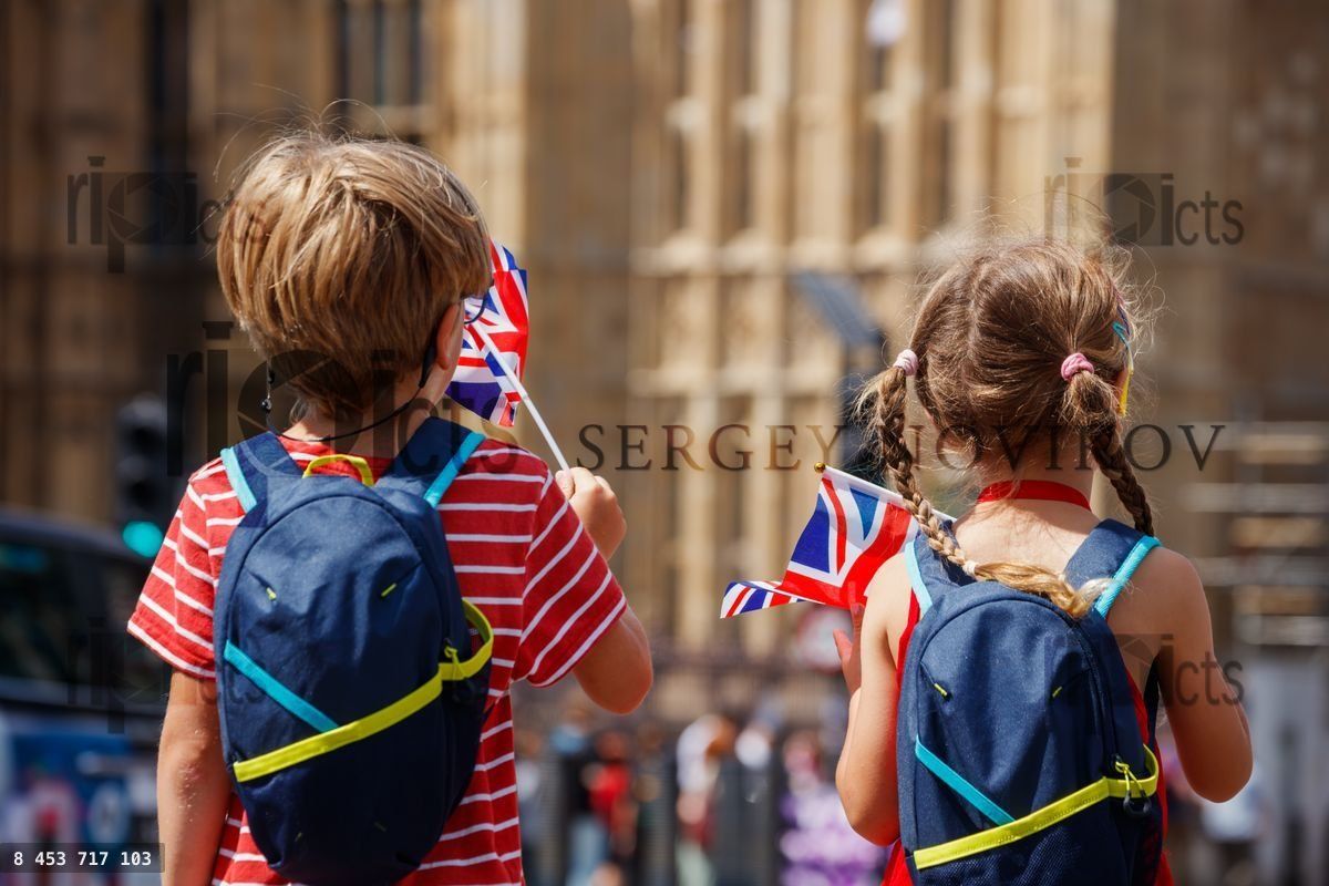 Young explorers boy and girl with flag embark on sightseeing