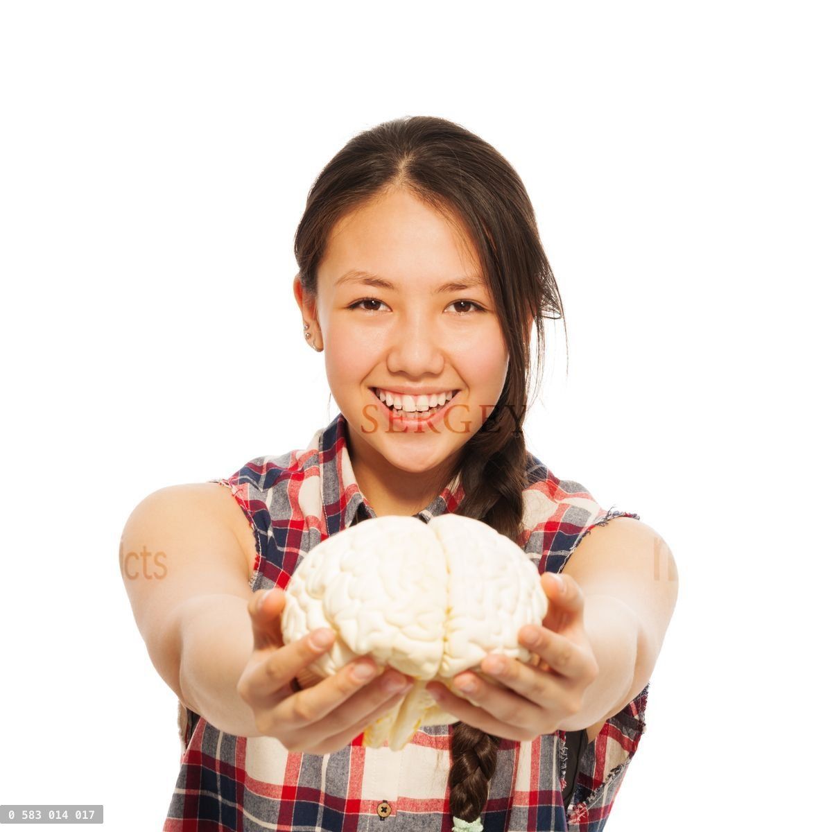 Young Asian girl holds cerebrum model in her hand