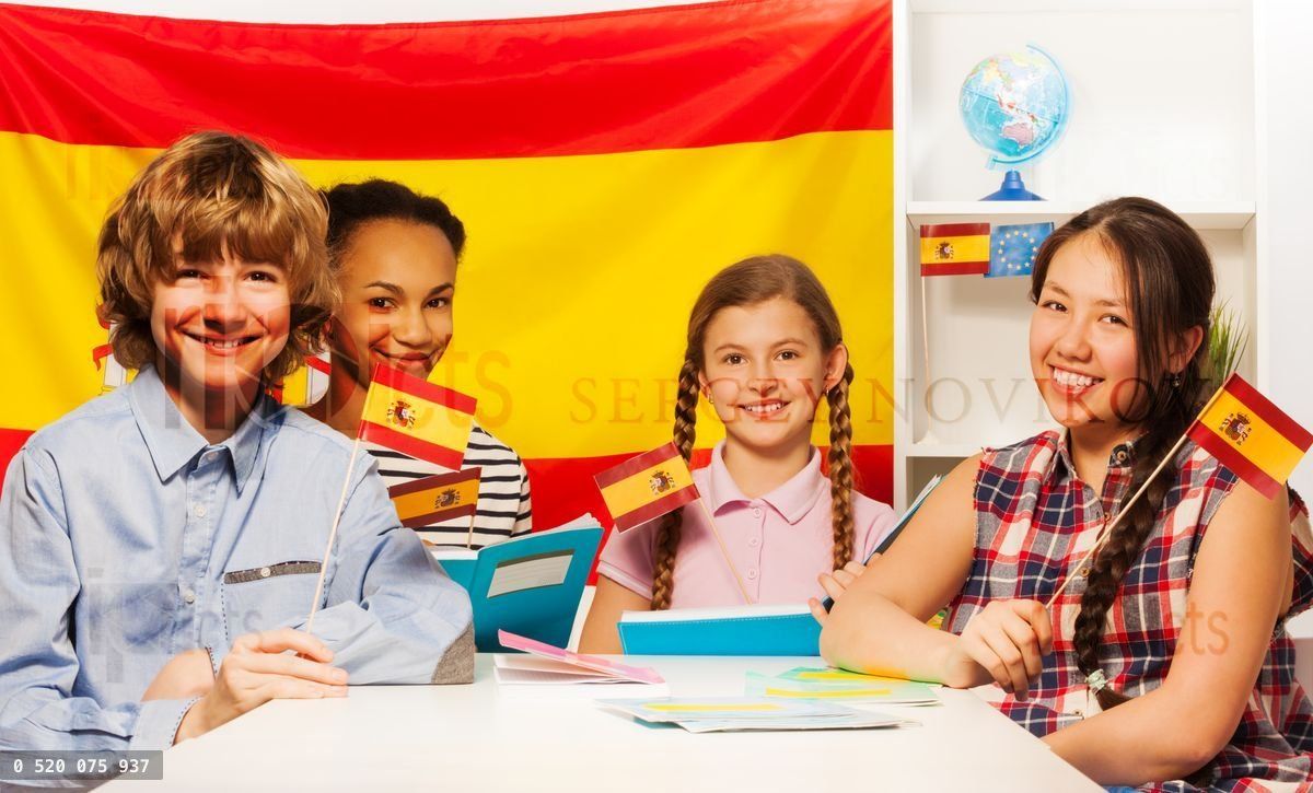Four happy multiethnic students holding flags