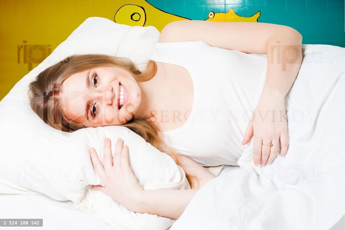 Woman smile in bed