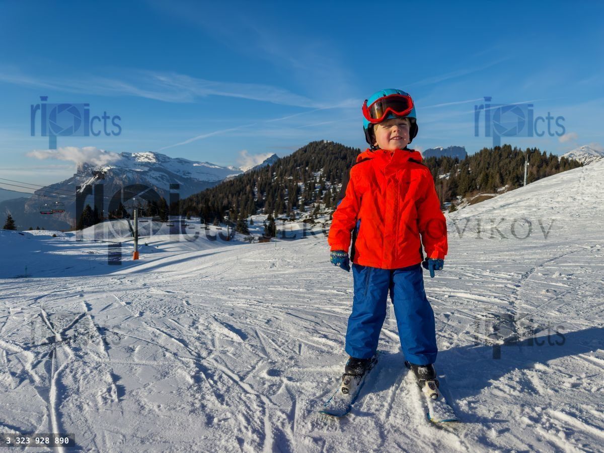 Young skier in ski gear, ready on French mountain slope