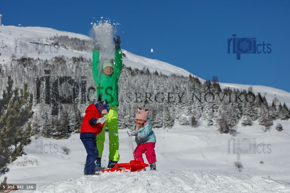 Friends have fun in snow day playing outdoors