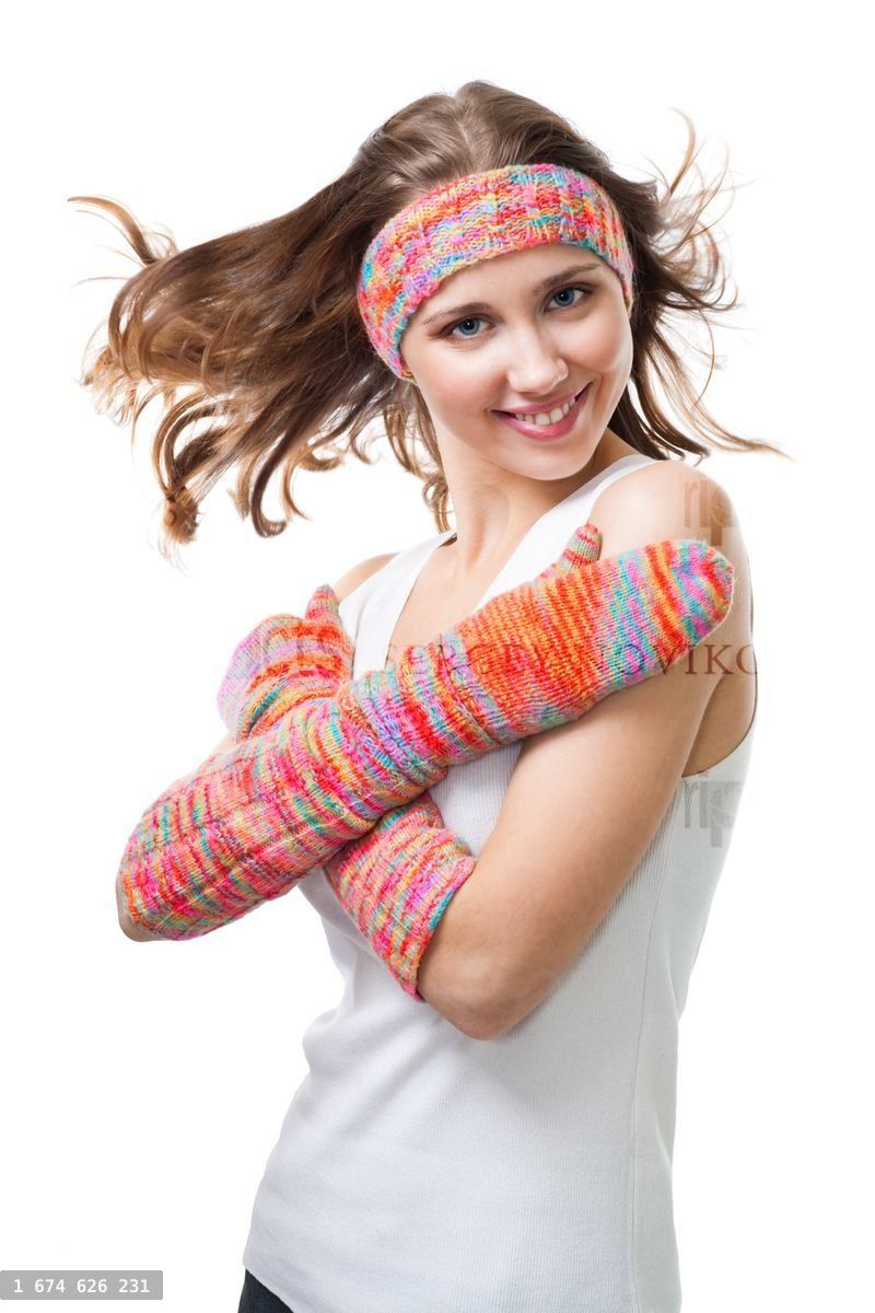 Woman smile standing in color wool gloves