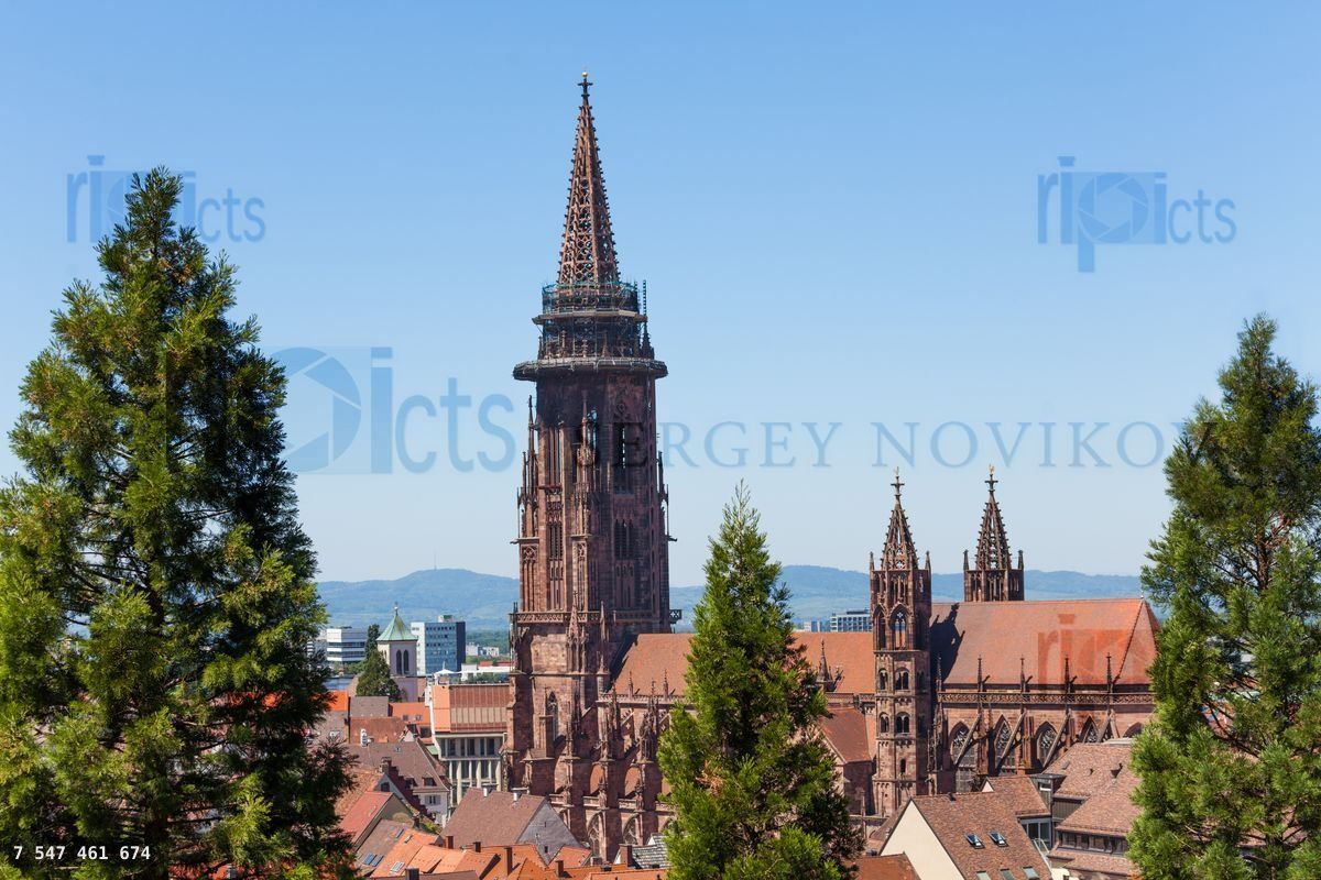 Freiburg cathedral tower against blue sky, Germany