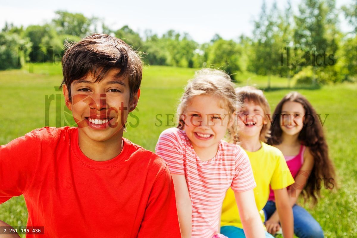 Close up view of positive boy and friends behind