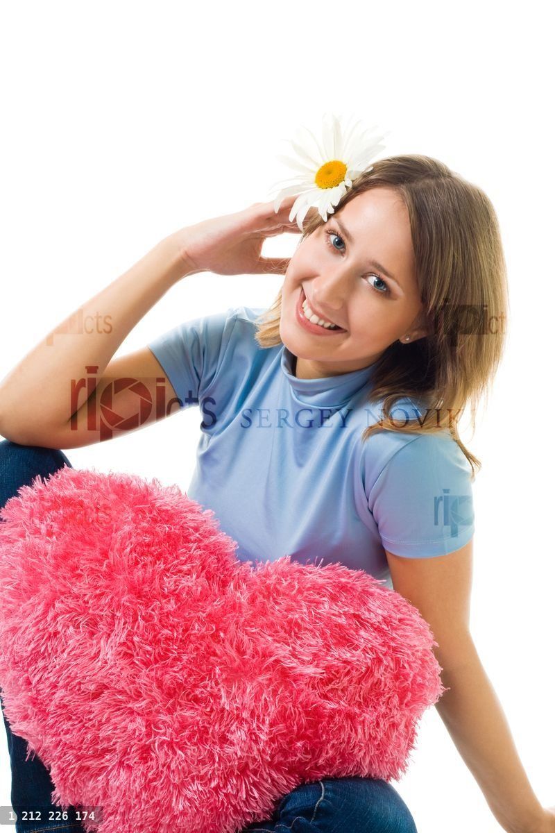 Woman sit with camomile and teddy red heart