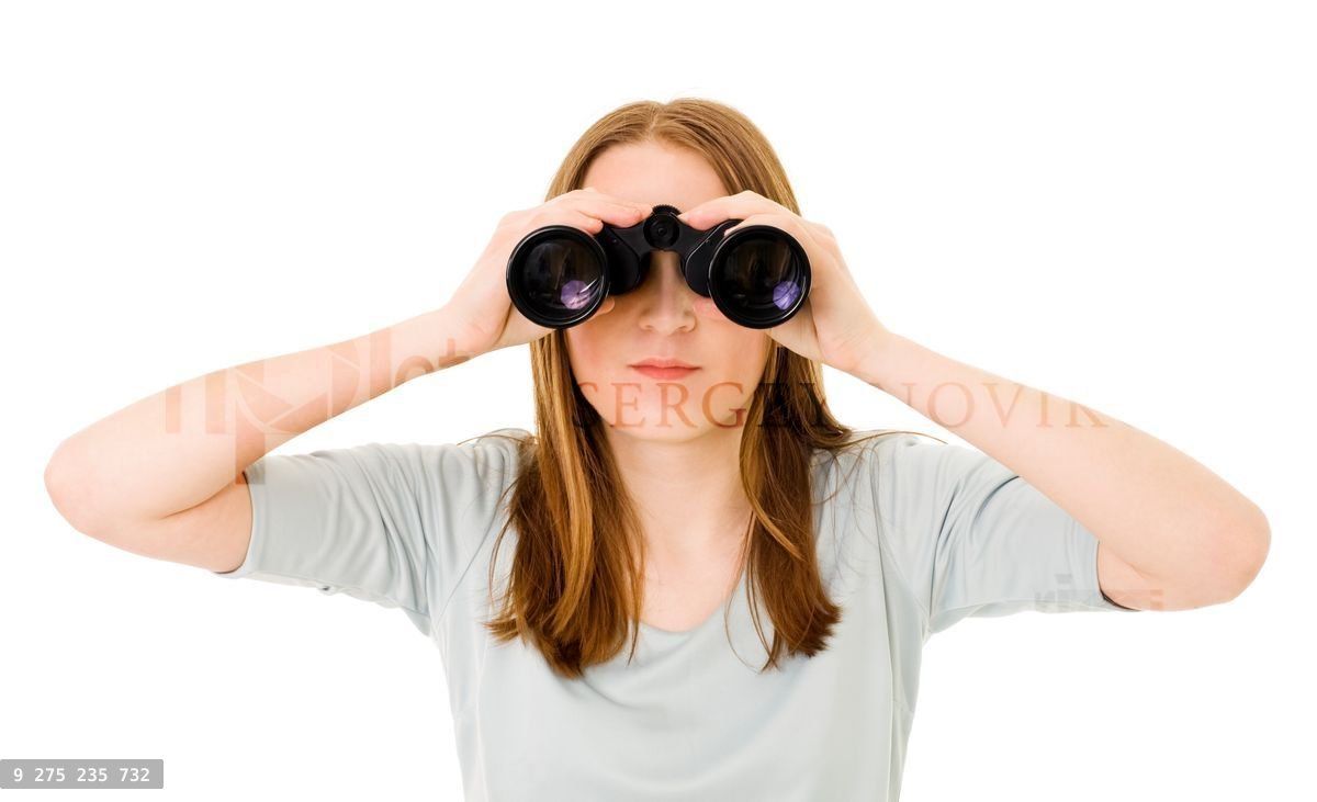 Woman looking into pair of glasses