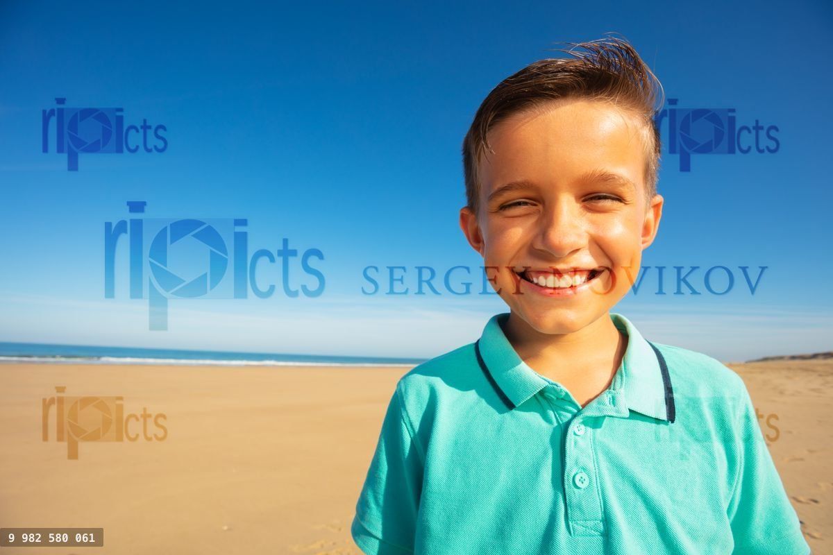 Handsome boy portrait on the sand sea beach
