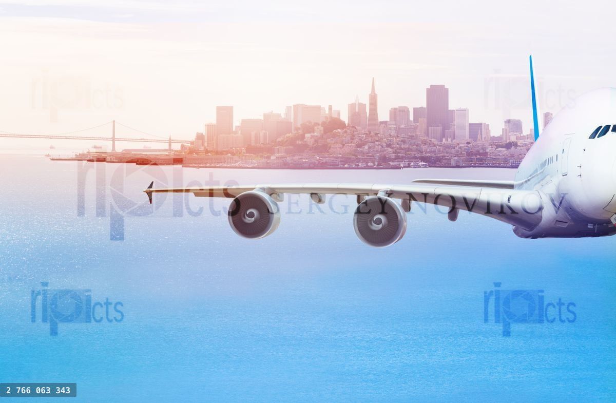 Front view of airplane in air at San Francisco bay