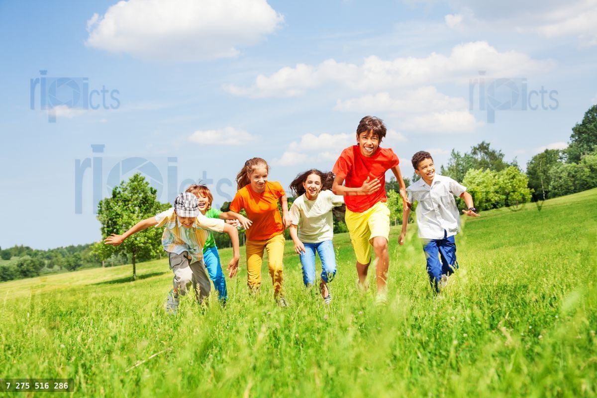 Funny children running in the field