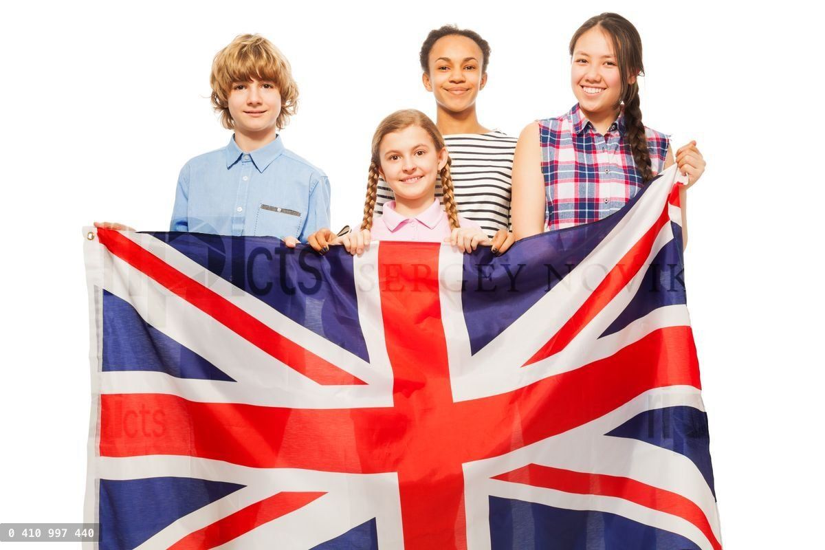Four multiethnic teenage kids with British flag